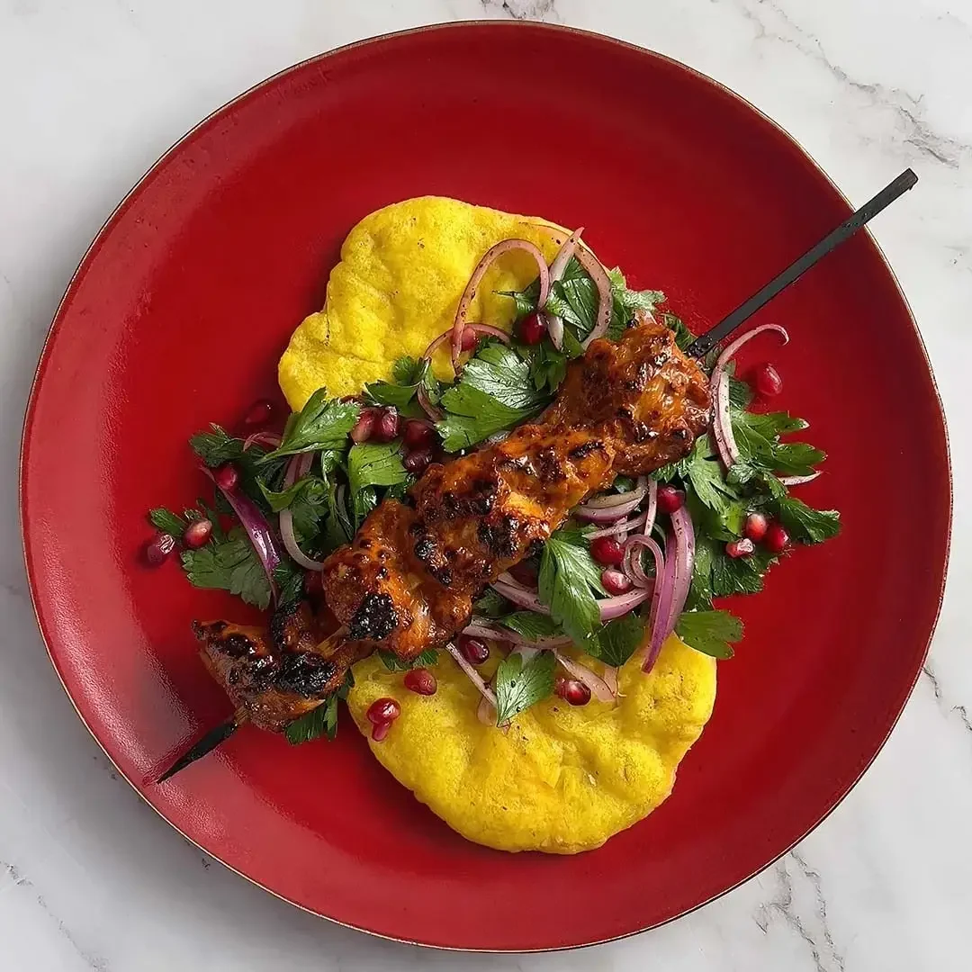 Spicy Honeyed Chicken Kebabs and Parsley Salad Wrapped in Bara