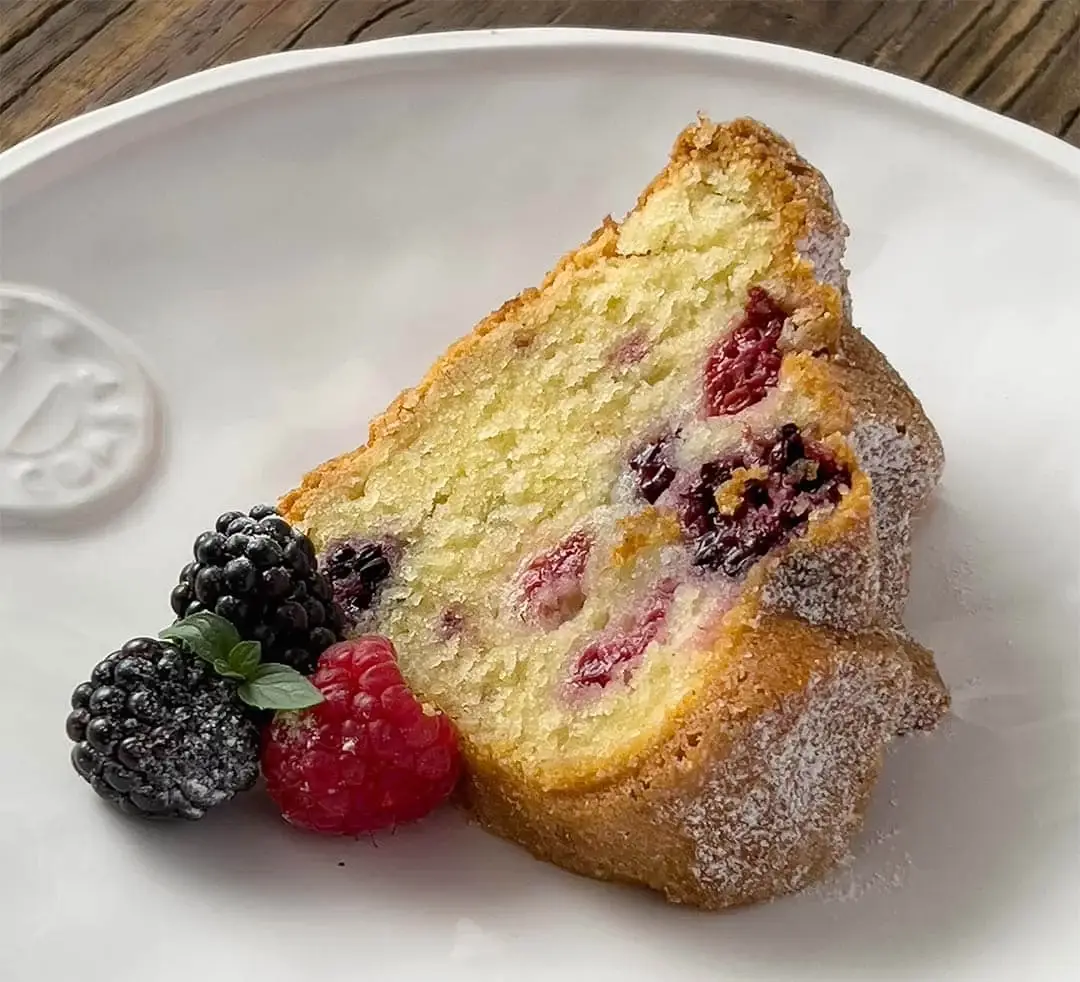 Slice of Blackberry, Raspberry, and St. Germain Bundt Cake