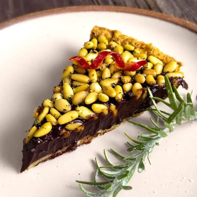 Slice Of Chocolate and Chili Pine Nut Tart