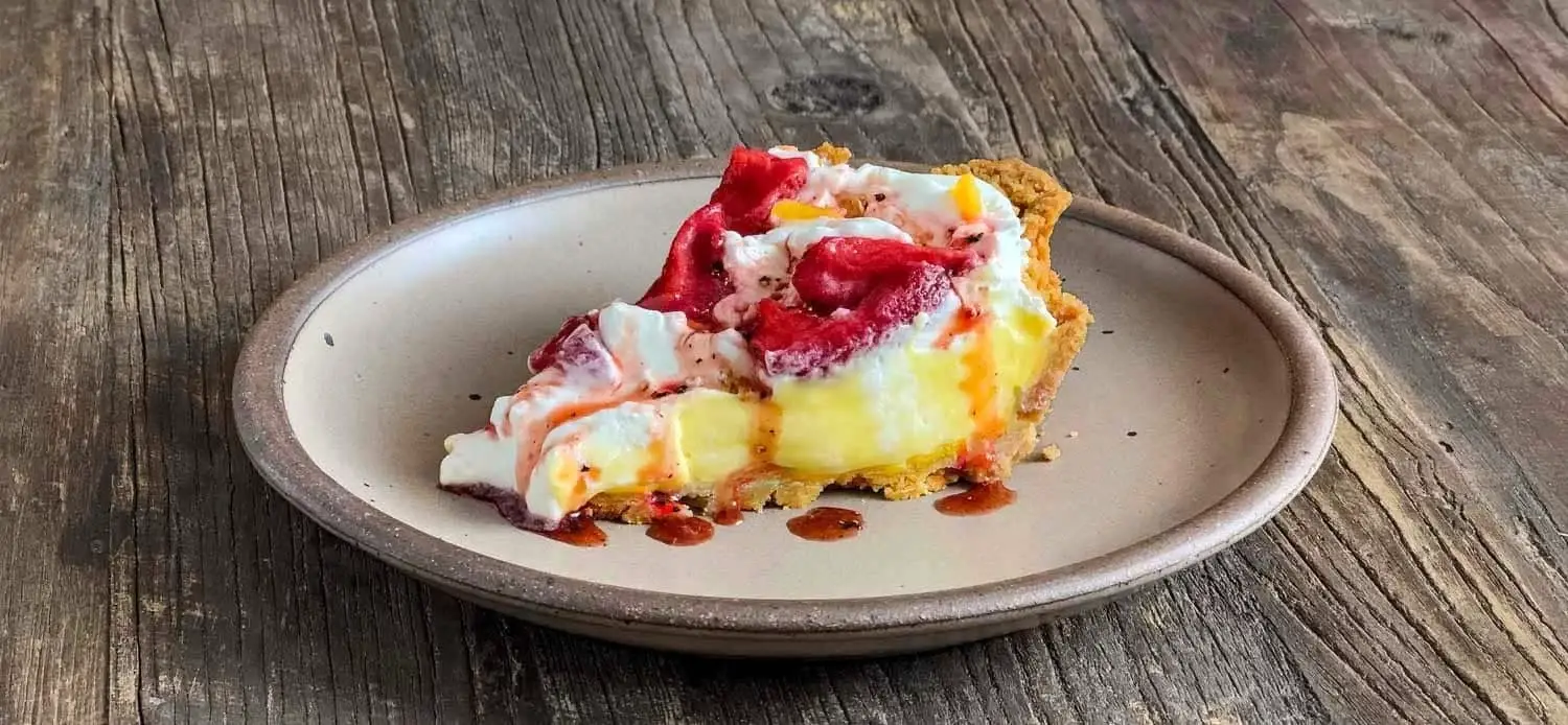 Slice of Meyer Lemon Cream Pie with Roasted Strawberries