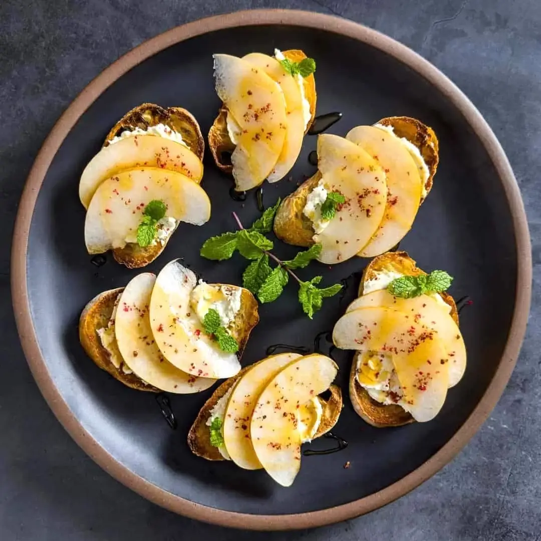 Goat Cheese Toasts with Korean Pear and Spicy Honey