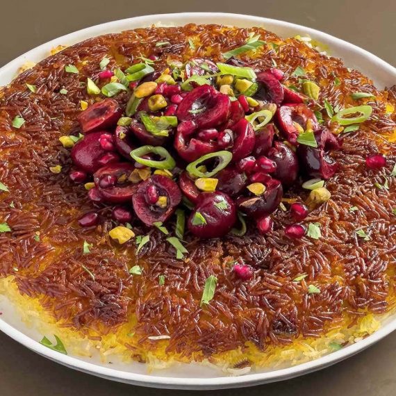 Tahdig Topped with Cherry and Pomegranate Salad